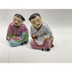 Pair of Chinese Republic figures of seated children H10cm, famille rose export circular shallow dish D25cm and a Moorish incense brick with arcaded base W19cm