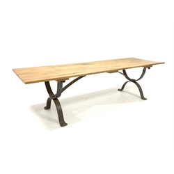 Large contemporary blacksmith made dining table, the rectangular oak top raised on wrought iron 'X' end supports 
