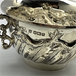 Victorian silver circular bowl engraved with foliage and laurel wreath cartouche D10.5cm London 1869 Maker John Hunt and Robert Roskell and a two handled silver bowl with embossed decoration and scroll handles Sheffield 1909 Maker Thomas Bradbury & Sons 10.6oz 
