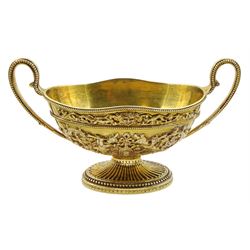 George III silver gilt sauce boat of oval design with two bead edge handles and with later applied cast decoration of angels, masks, flowers and foliage on a pedestal foot L23cm London 1783 Maker Thomas Chawner 20.6oz.  Provenance:  Sotheby's sale of the contents of Easton Neston on behalf of the Hesketh family.  May 17th 2005 Lot 909