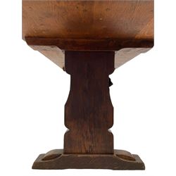 Mouseman - circa. 1940s adzed oak refectory dining table, rectangular pegged plank top, shaped solid end supports on sledge feet joined by floor stretcher, carved with mouse signature, by Robert Thompson of Kilburn