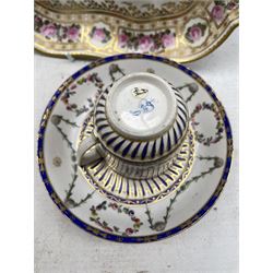 18th century Derby shallow dish with a centre panel of flowers and within a gilt and floral border W24cm, No.129, a smaller plate with a blue and gilt border D19cm, No.219, trio of two cups and saucer with moulded blue, gilt and floral decoration, Derby jug of fluted design H7cm and two Derby tea bowls