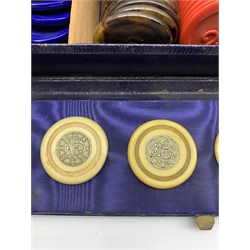 Edwardian blue leather games box containing four Victorian ivory gaming counters each silver inlaid with the number 5 and monogram to the reverse, together with two trays of ivorine and plastic gaming counters, L23cm 
