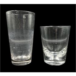 Late 18th century glass tumbler, of plain tapered form, H12cm x D9.5cm, together with an oversized 18th century glass tumbler (2)