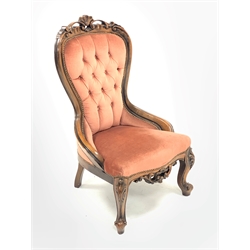 Victorian style beech framed nursing chair, shell and scroll carved cresting rail, upholstered in buttoned pink fabric, cabriole supports, W60cm