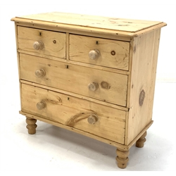 Victorian polished pine chest fitted with two short and two long drawers, raised on turned supports 