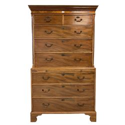 Georgian mahogany chest-on-chest, dentilled cornice over two sort and three long drawers flanked by reeded canted edges, the lower section fitted with brushing slide over three drawers, raised on bracket feet