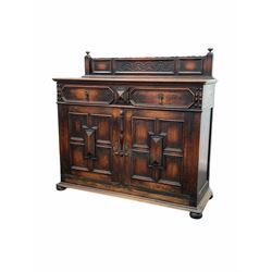 Early 20th century oak sideboard, raised back over two drawers and two cupboards with geometric panelling, each enclosing a shelf, raised on compressed bun supports W122cm, H111cm, D46cm
