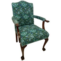 Early 20th century Georgian design Gainsborough chair, shaped back and sprung seat upholstered in cerulean and green foliate patterned fabric, arm terminals carved with acanthus leaves, raised on cabriole front supports with ball and claw feet