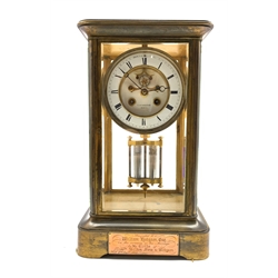 Late 19th century brass and four glass presentation clock, with white enamel dial and Roman numeral chapter ring, inscribed 'T. Reynolds, Hull,' with mercury pendulum and eight day movement striking half hours on bell, H34cm