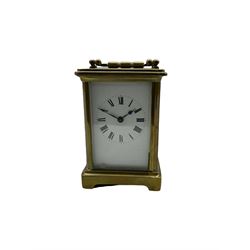 A French corniche carriage clock c1880 with five bevelled glass panels, enamel dial with roman numerals, minute track and steel spade hands, eight-day movement with a replacement jewelled lever platform escapement. With key. 



