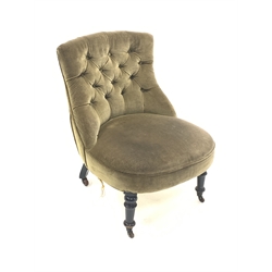  Victorian nursing chair upholstered in buttoned green velvet, raised on turned ebonised supports and castors, W60cm  