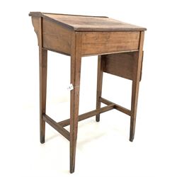 Early 20th century pitch pine clerks desk, writing slope lifting to reveal plain interior, with a drop leaf surface to one end, raised on square tapered supports united by 'H' stretcher W68cm, H105cm, D62cm