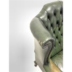Early to mid 20th century wing back chair, upholstered in studded and deep buttoned green leather, with squab cushion, raised on cabriole supports W81cm