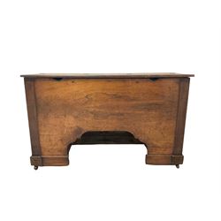 19th century mahogany cabinet, the hinged top opening to storage area, raised on castors 