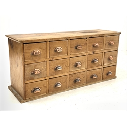 Victorian pine chemist type haberdashery chest fitted with fifteen drawers, each drawer with cup handle, W117cm, H54cm, D37cm