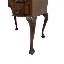 Late 19th century mahogany bureau, the raised back carved with gadroon decoration and supported by brass spindles, the fall-front decorated with central moulded shell and extending foliate applique concealing fitted interior, lower section fitted with central frieze drawer over two shorted drawers, the moulded apron carved with gadroons, the cabriole supports with moulded foliate knees terminating in ball and claw feet
