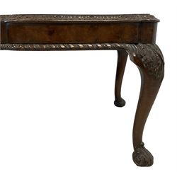 Queen Anne design figured walnut coffee table, shaped top with foliate carved moulded edge, gadrooned lower edge over cabriole supports with acanthus carved scroll feet