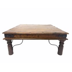Eastern hardwood square coffee table, iron studded and with wrought brackets, raised on turned supports 100cm x 100cm, H42cm