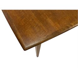 Mid-20th century teak dining table, pull-out extending top with fold-out leaf, on square tapering supports, retailed by Heals