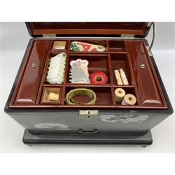 Japanese black lacquer sewing box inset with silver coloured dragons, the red lacquered interior with lift out tray and covered containers, single drawer under on a stand with shaped supports 40cm x 30cm x 27cm 