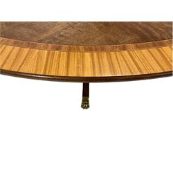 Georgian design mahogany tilt-top centre table, circular top with satinwood crossbanding and ebony and boxwood stringing, ring turned vasiform pedestal with splayed supports terminating in brass hairy paw feet and castors