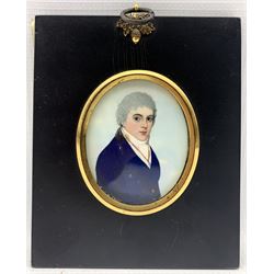 19th century oval portrait miniature, half length watercolour on ivory of a young gentleman wearing a blue coat and in ebonised frame 6.5cm x 5.5cm. This item has been registered for sale under Section 10 of the APHA Ivory Act