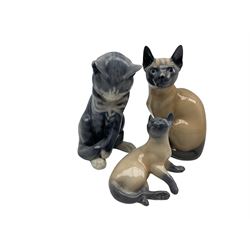 Two Royal Copenhagen Siamese cat models No.3281 and no. 2862 together with another Royal Copenhagen Tabby cat no. 370 (3)
