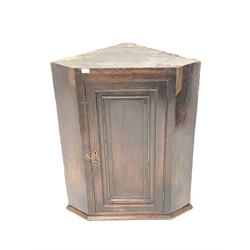 Early 19th century oak corner wall cupboard enclosed by fielded panel door W82cm
