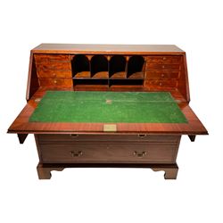 Late 19th century mahogany bureau, the crossbanded fall front enclosing small drawers and pigeon holes, fitted with three graduating drawers, on bracket feet