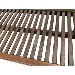 Early to mid-20th century teak garden bench, slatted back and seat, raised on square supports with shaped spandrels