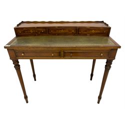 Edwardian Revival yew wood writing desk, three quarter raised gallery over the concave raised top fitted with three drawer, each facia inlaid with floral decoration and ebony stringing, with inset leather writing surface, base fitted with two cock-beaded and banded drawers, on turned tapering supports