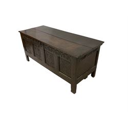 18th century oak coffer or chest, rectangular hinged two plank lid with moulded edge, the frieze carved with lunettes over four carved panels with scrolling and rosette decoration, the panelled sides with carved arch friezes dentilled apron, raised on stile supports 
Provenance: property of a gentleman