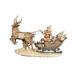 Large Lladro glazed model 'Up and Away' (Trineo Santa Claus), modelled as Santa Claus in his Sleigh, pulled by two Reindeer, designed by Juan Huerta, issued in 1993 and retired in 1996, L54cm x H34cm approx, complete with original box