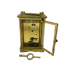 A French early 20th century eight-day Corniche timepiece carriage clock with a jewelled lever platform escapement with timing screws, white enamel dial with Roman numerals, minute markers and steel spade hands, bevelled glass panels to the case and a rectangular glass panel to the top of the case with original base plate.
With Key.
