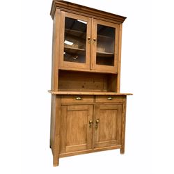 Victorian pine kitchen dresser, the raised back with two glazed doors enclosing two shelves over base fitted with two drawers and two cupboards, raised on stile supports W106cm, H190cm, D56cm