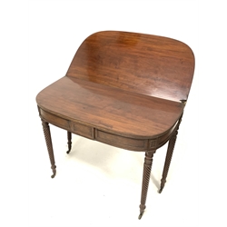 Georgian mahogany fold over tea table, the bow front top with reeded edge, raised on spiral turned supports terminating in brass cup castors, W92cm x 46cm, H76cm