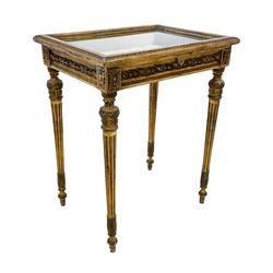 French style giltwood and gesso table vitrine or bijouterie cabinet, bevel glazed hinged lid in leaf and bead moulded frame, lined interior, the frieze panels decorated with foliage twist mouldings and flower head motifs, on turned and fluted supports decoration with foliate motifs, W61cm, H74cm, D45cm