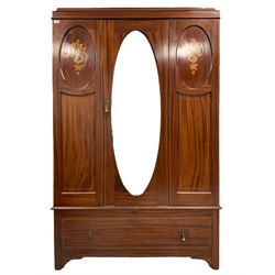 Edwardian mahogany wardrobe, the projecting cornice over banded frieze, single cupboard door with oval bevelled mirror enclosing hanging rail and hooks, flanked by inlaid panels with satinwood shells and floral design with boxwood stringing, fitted with single drawer to base, raised on bracket feet