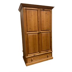 Rustic pine double wardrobe, two panelled doors over single drawer