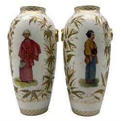 Pair Continental porcelain vases and covers, over painted and gilded with Japanese figures, indistinctly signed, H22cm (a/f)