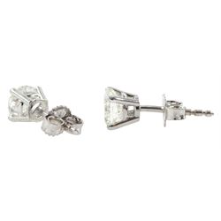 Pair of 18ct white gold round brilliant cut diamond stud earrings, stamped 750, total diamond weight approx 1.20 carat