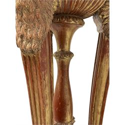 Late 20th century carved beech torchere or floor lamp in the manner of Adams, terracotta bole and gilt finish, three fluted and tapered uprights with mythological bearded faun carved terminals supporting circular top with gadroon moulded underbelly and flower head carved rim, central turned and acanthus carved pedestal support on concave triform base with carved rams head terminals, decorated with trailing bell flower swags and floral cartouches, carved with three hairy paws to each corner, stepped moulded base platform raised on block bracket feet