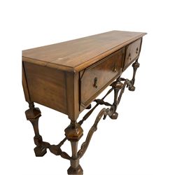 18th century design walnut dresser base, the rectangular top with moulded edge over two long drawers, raised on baluster supports united by a stretcher W168cm, H85cm, D45cm  