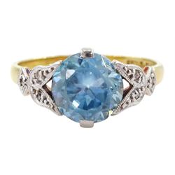 Early 20th century gold round cut blue zircon ring, with diamond set fancy shoulders, stamped 18ct Plat