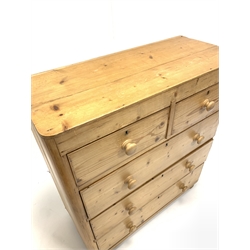Early 20th century pine chest, fitted with two short and three long drawers, raised on bun supports 