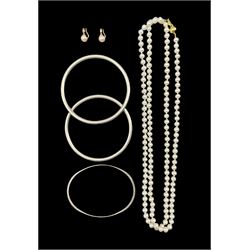 Single strand pearl necklace, with 9ct gold clasp stamped 375, pair of 9ct gold pearl clip on earrings hallmarked and three silver bangles