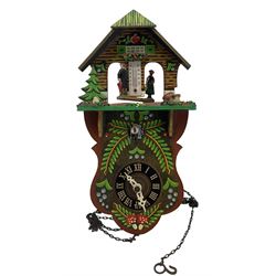 Two Bavarian cuckoo clocks and a modern barometer with clock and thermometer