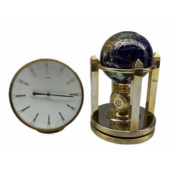 A globe desk clock with two battery driven clock dials, hygrometer and thermometer, globe and base rotate separately.
With a retro 1960s  spring driven Kienzle timepiece mantle clock with a 6-inch concave dial, gilt baton hands and hour markers, hand wound and set from the rear.
