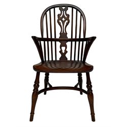 Elm child's Windsor armchair, hoop and stick back with pierced splat, dished seat on turned supports joined by crinoline stretcher